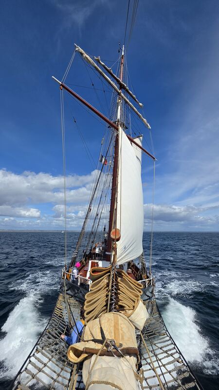 Looking aft from the bowsprit net, bow wave running